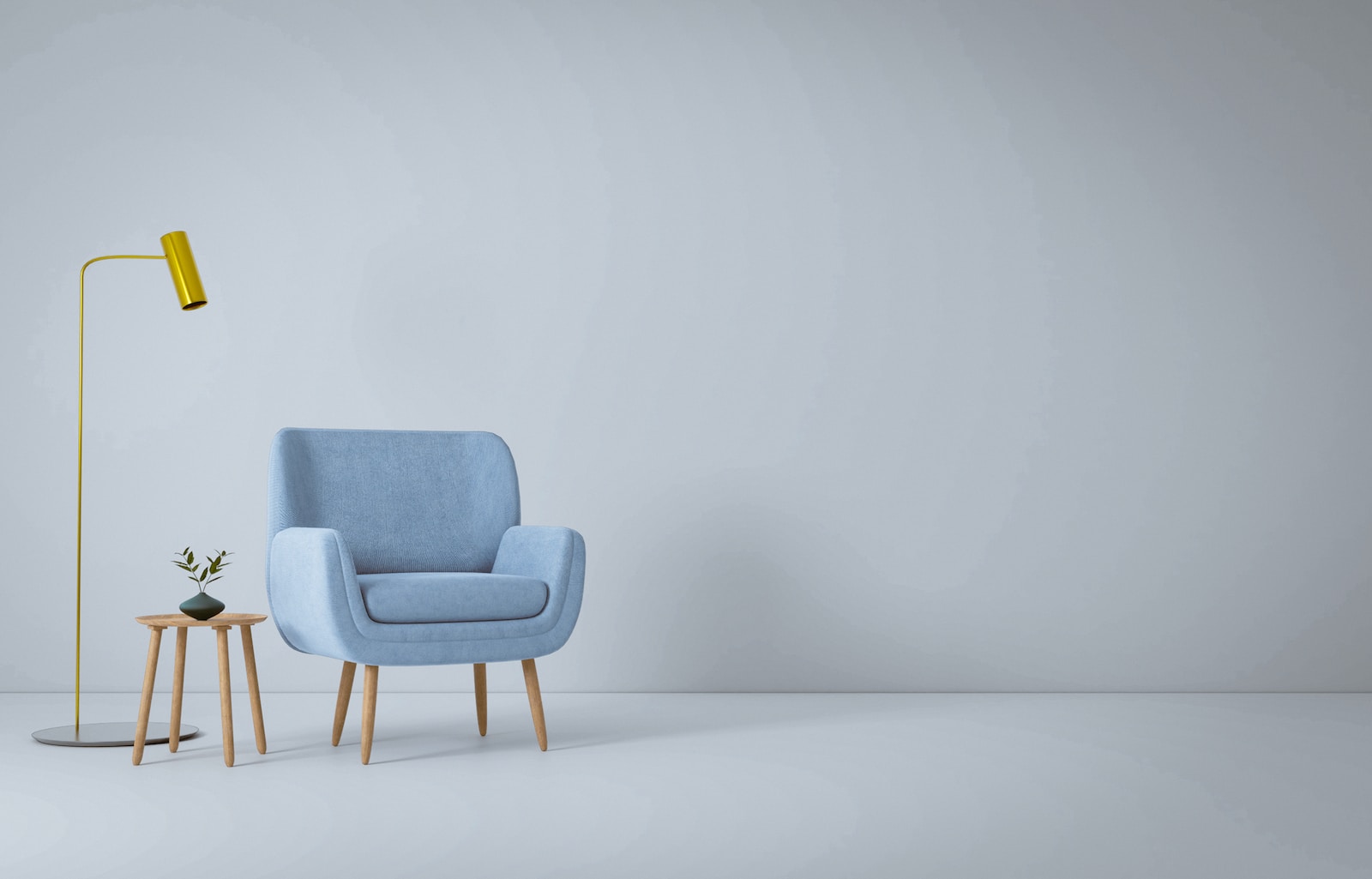 a blue chair and a yellow lamp in a white room