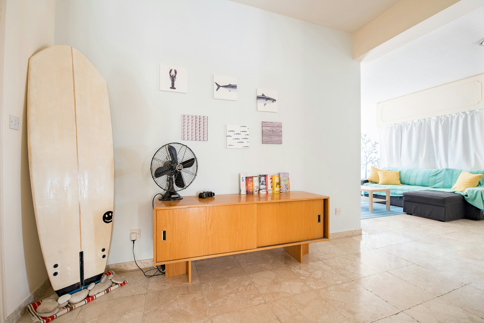 desk fan on credenza beside wall